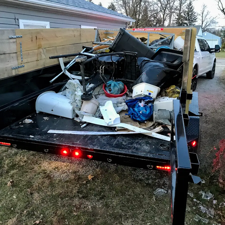 Roll-off dumpster delivered to a residential driveway in Monroe